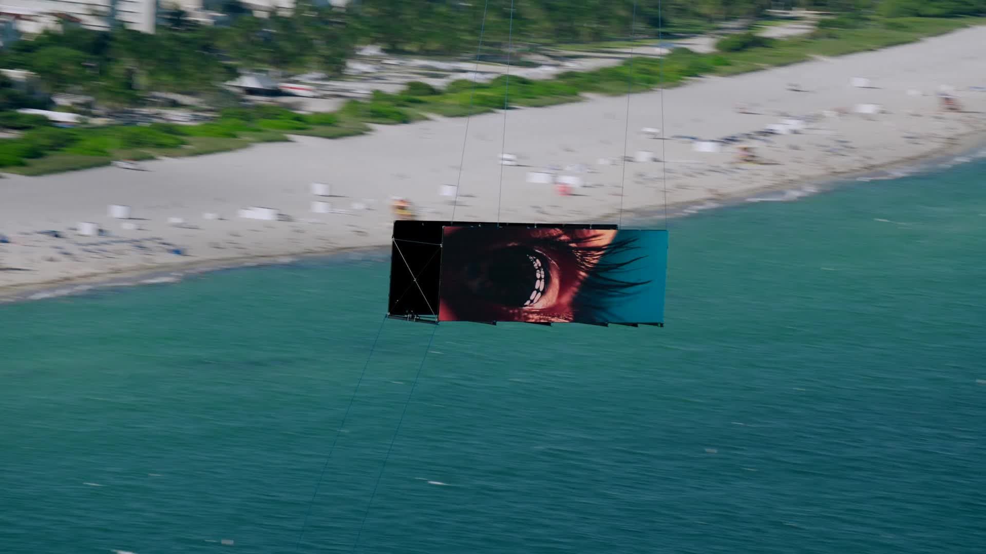 A HELI-D video screen flying over the coast
